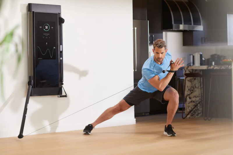 Man performing full-body workout with Tonal home gym