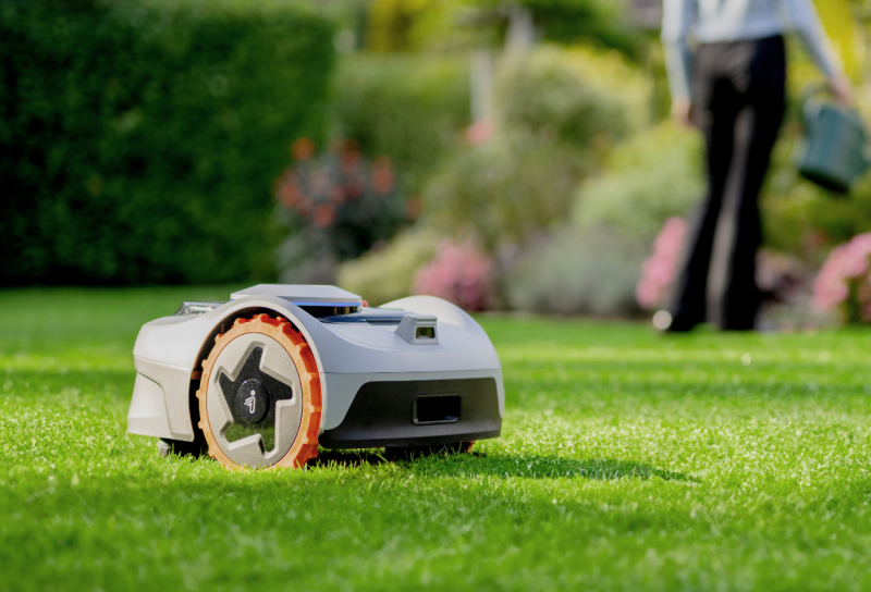 Close-up of Segway Navimow i Series robotic lawnmower navigating through grass