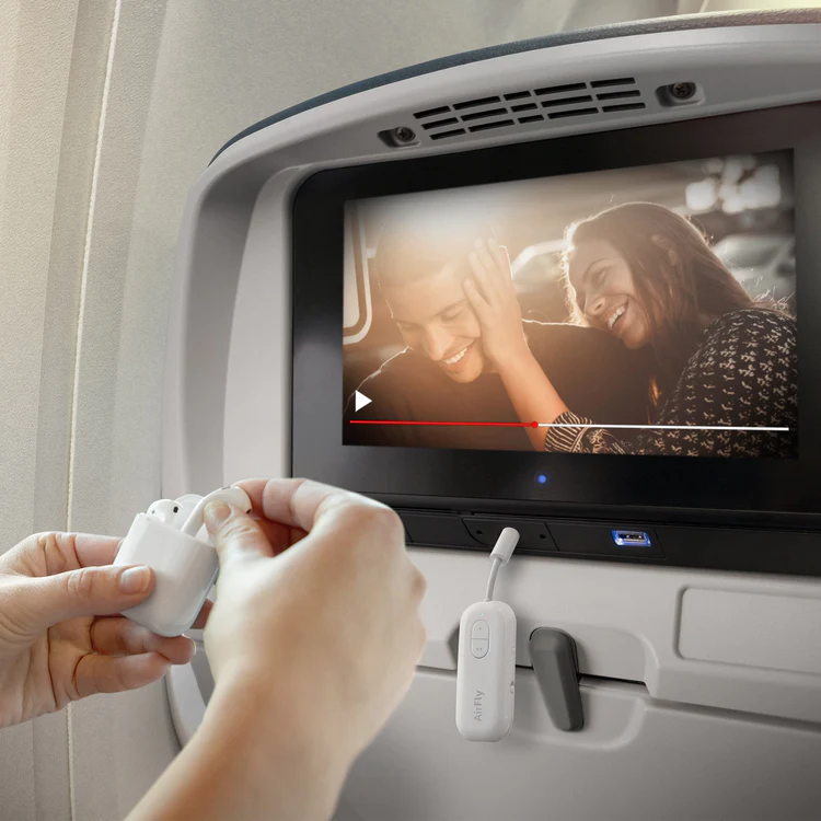 Person using AirFly SE on an airplane.