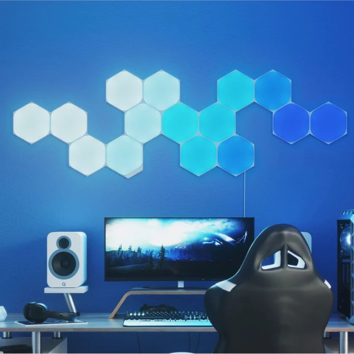 Colorful smart hexagon touch lights mounted on a wall in a gaming room